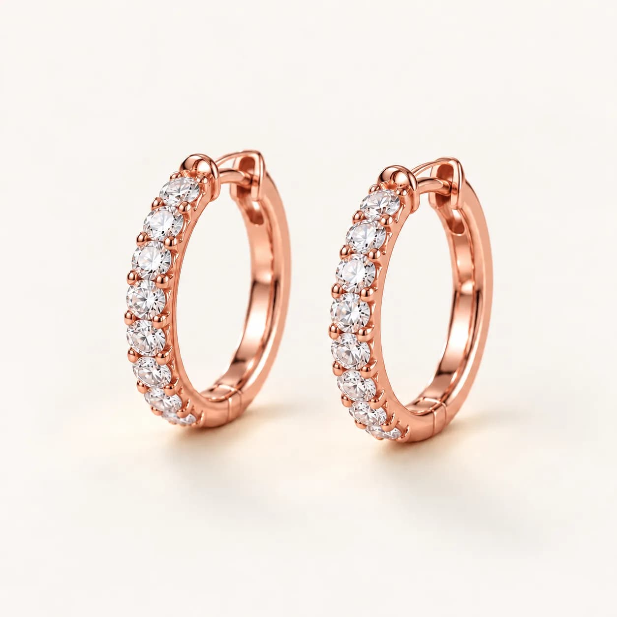 Diamond huggie hoop earrings in rose gold