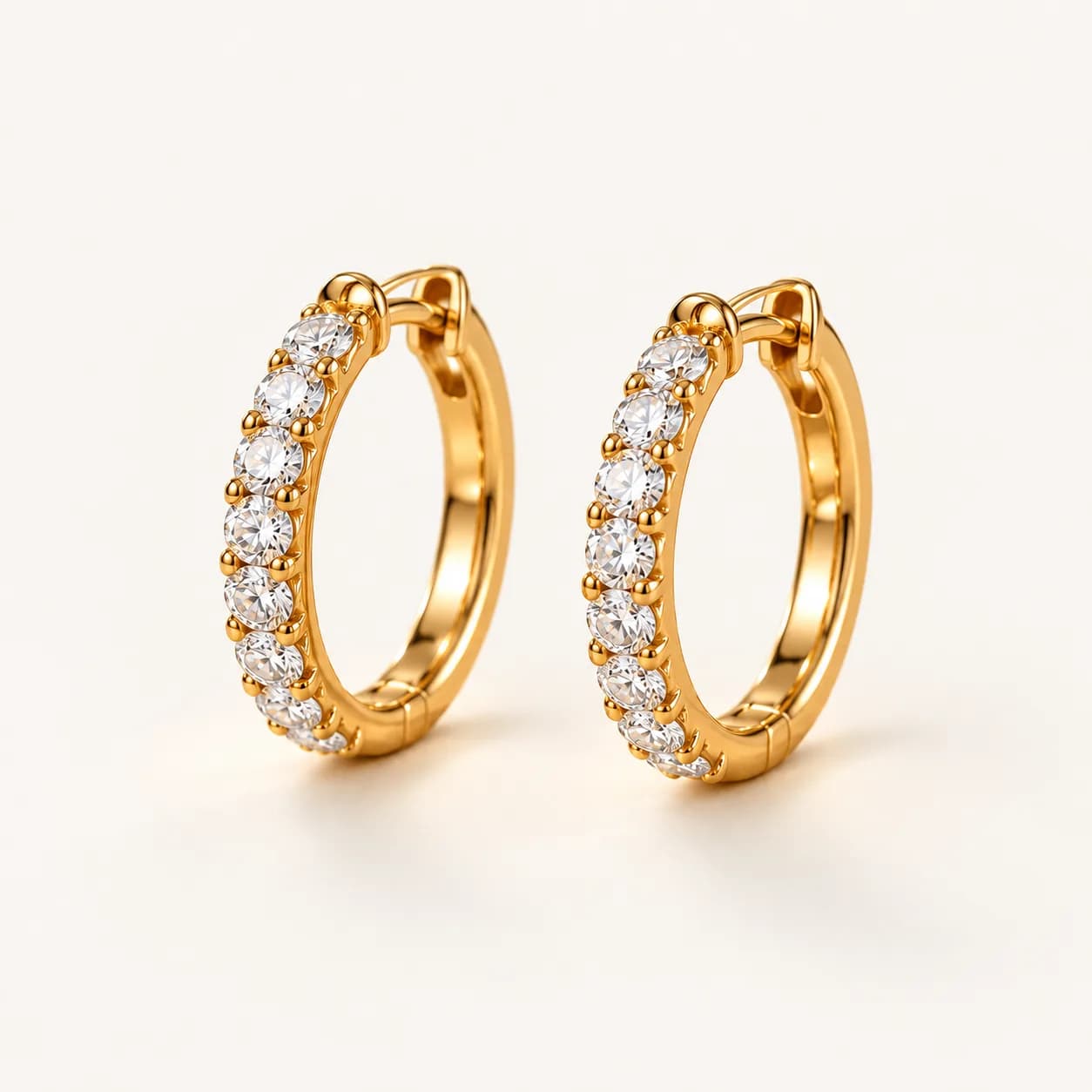 Diamond huggie hoop earrings in yellow gold