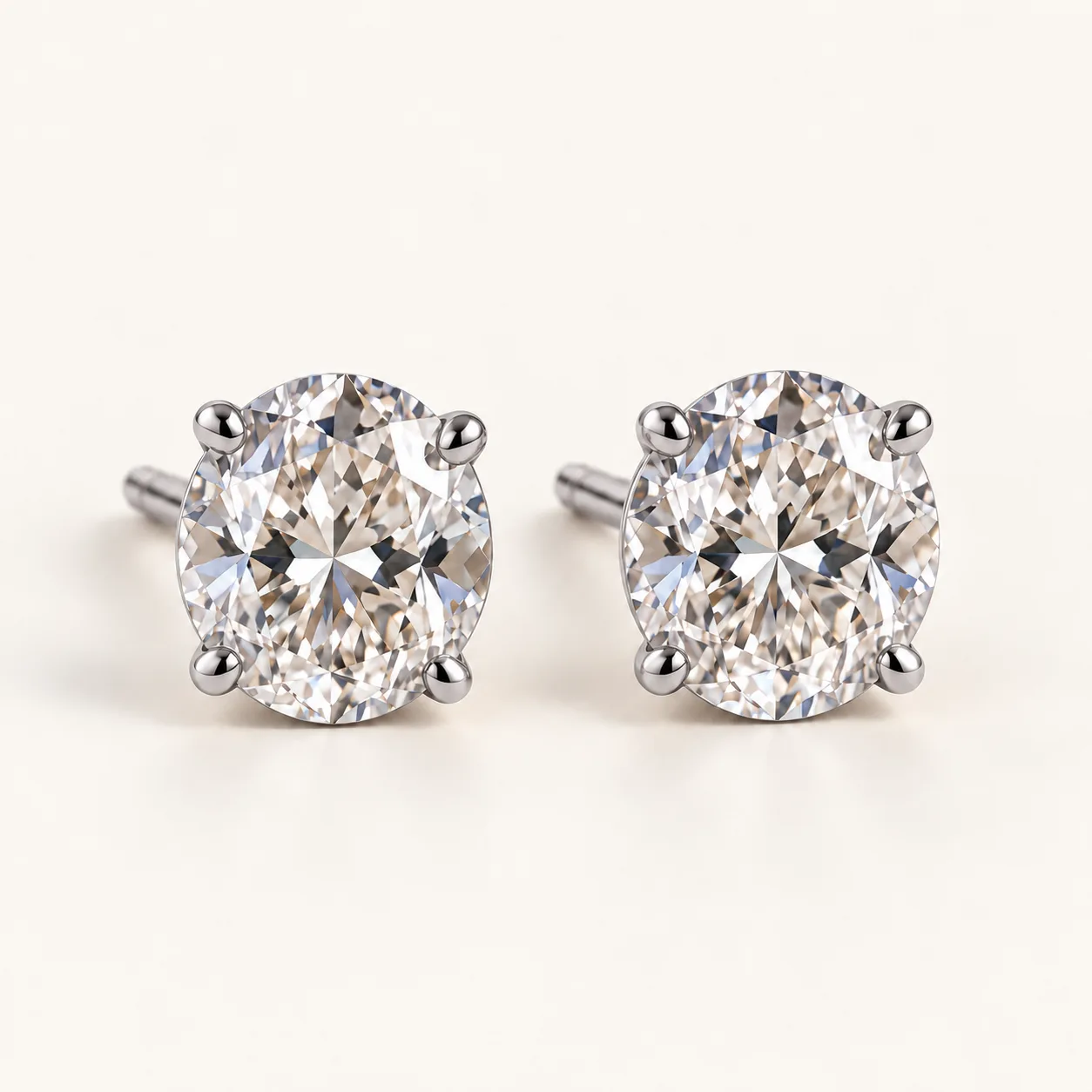 Oval diamond stud earrings in platinum
