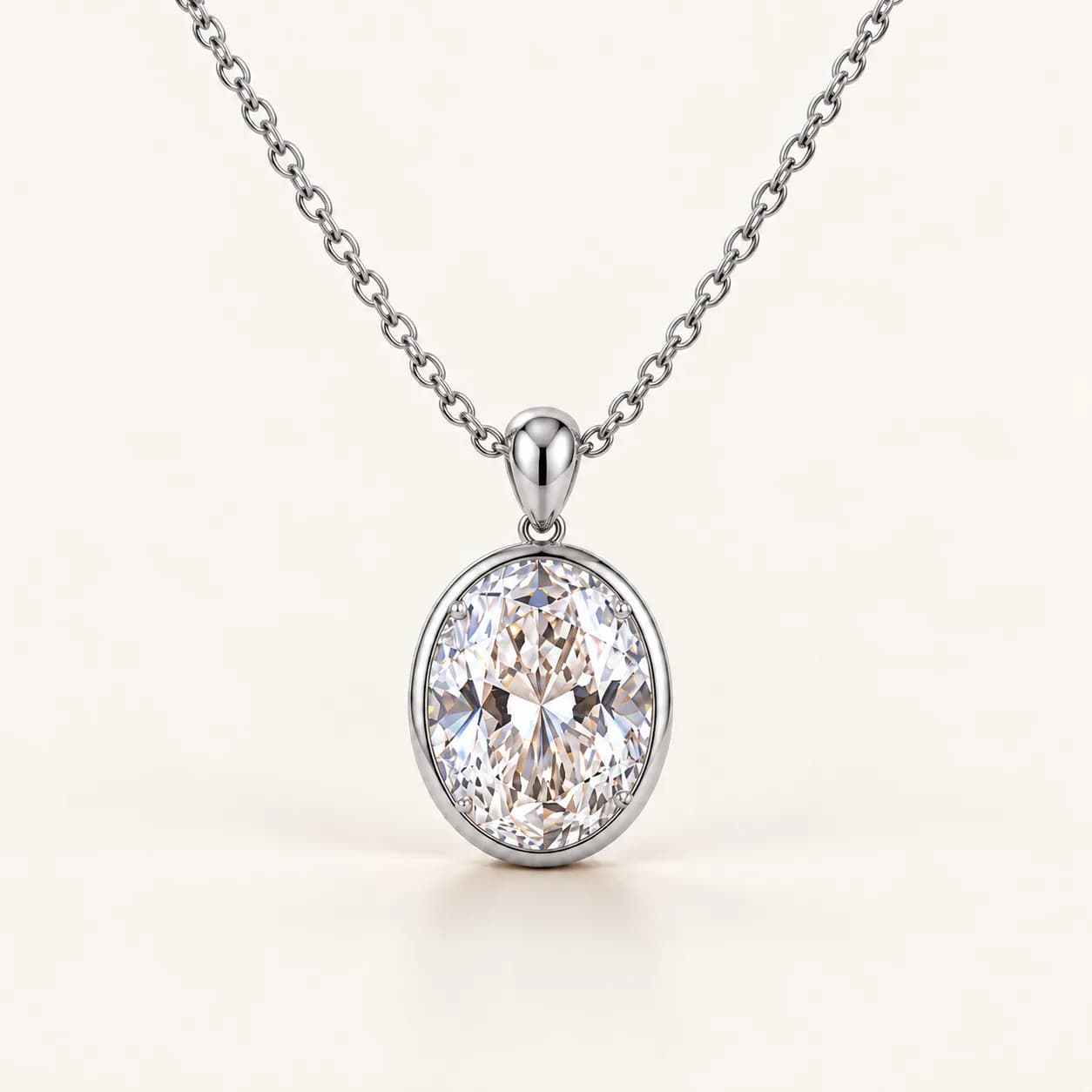 Oval diamond bezel pendant in white gold