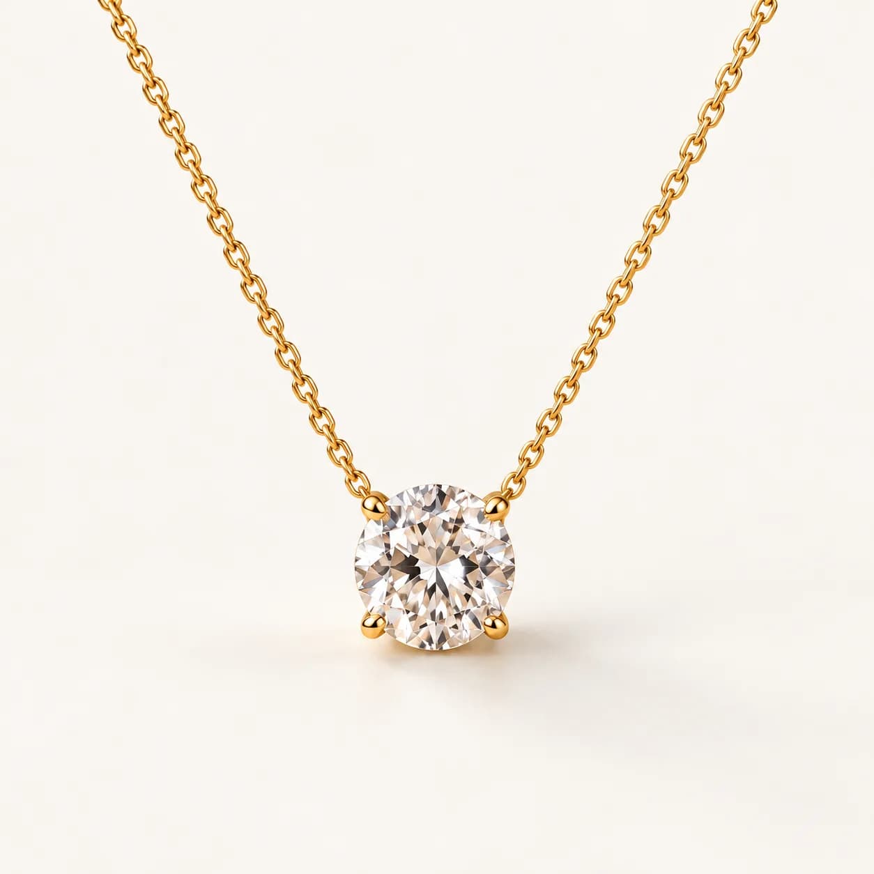 Round diamond solitaire pendant in yellow gold
