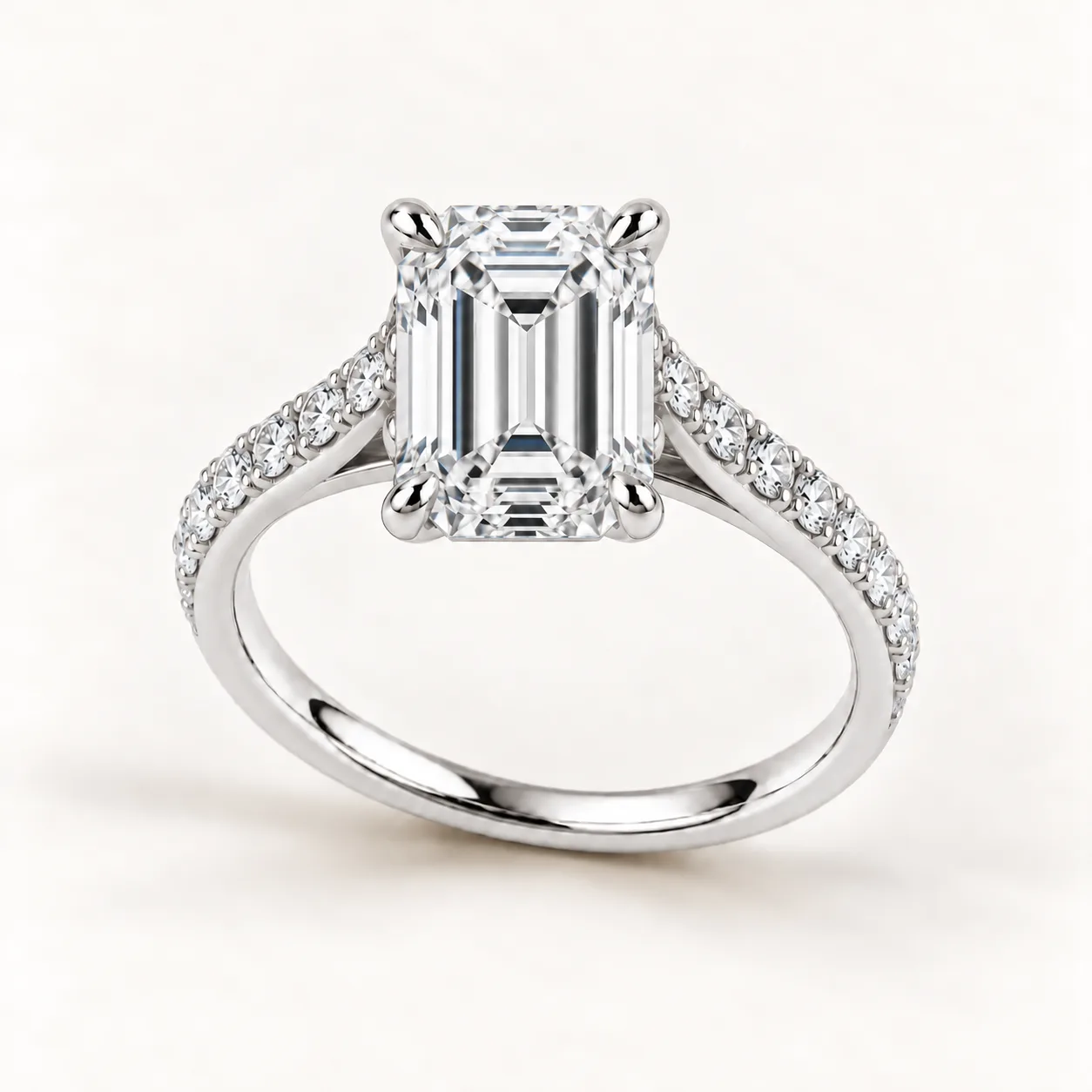 Emerald-cut diamond pavé engagement ring in white gold