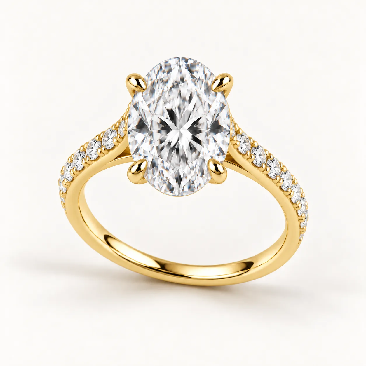 Oval diamond pavé engagement ring in yellow gold