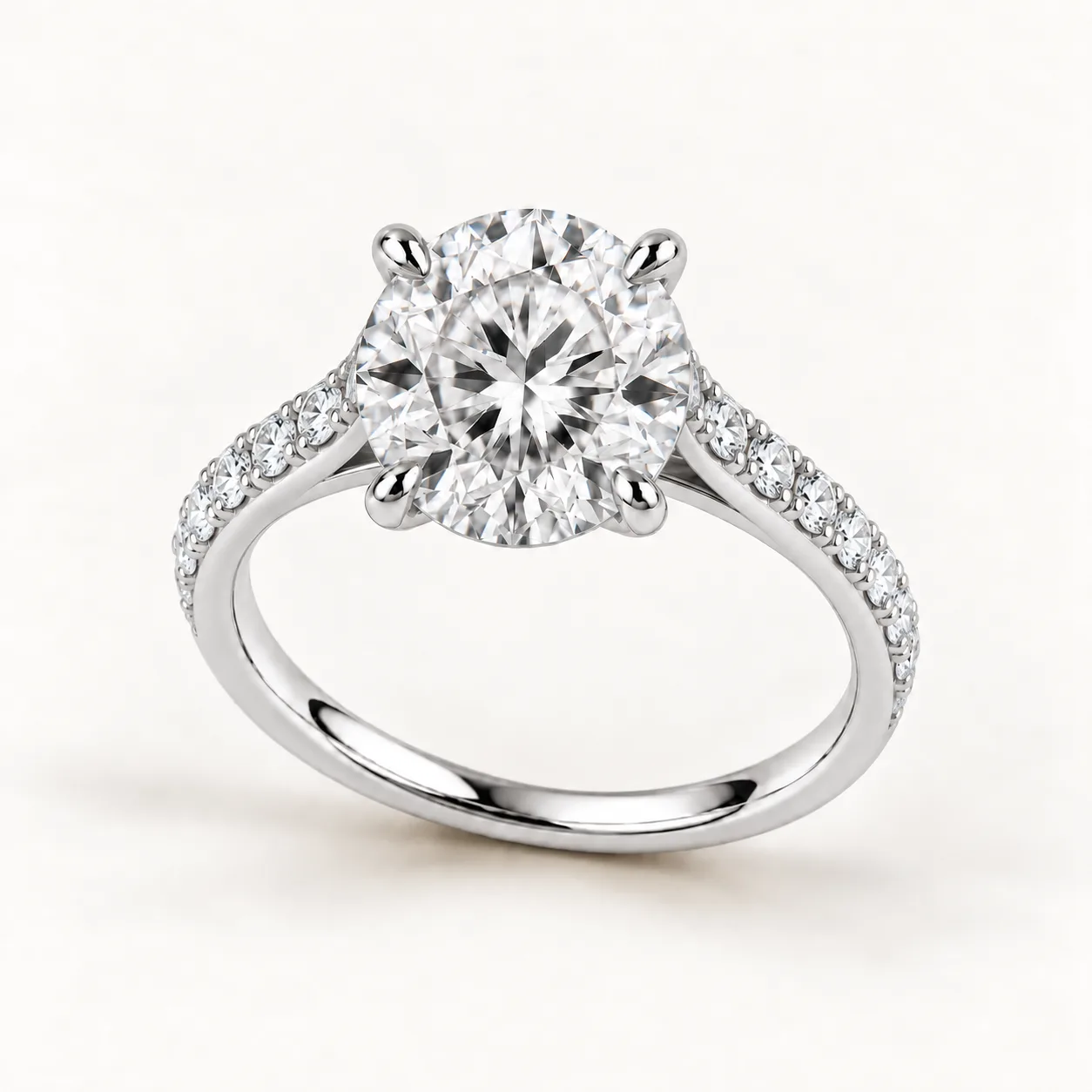 Round diamond pavé engagement ring in platinum