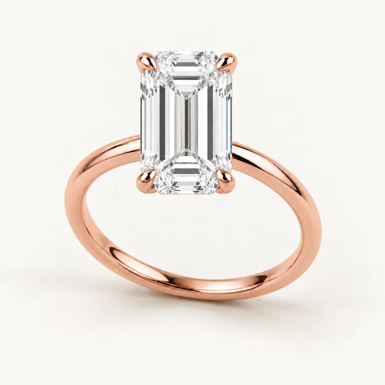 Emerald-cut diamond solitaire ring in rose gold