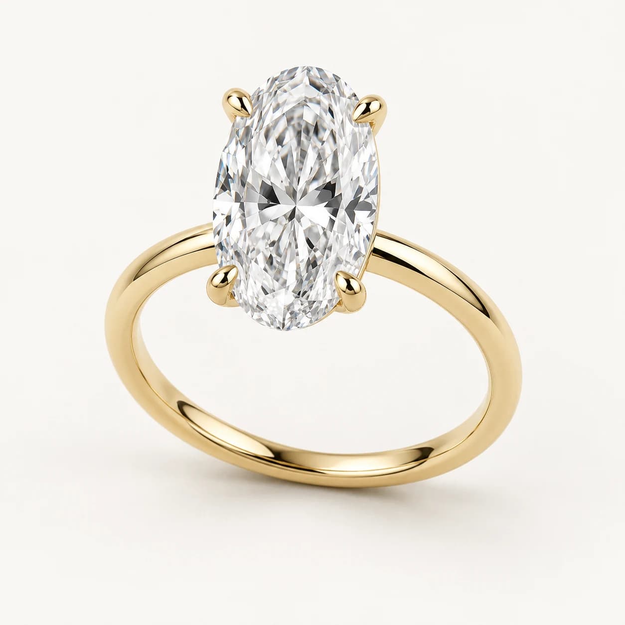 Oval diamond solitaire ring in yellow gold
