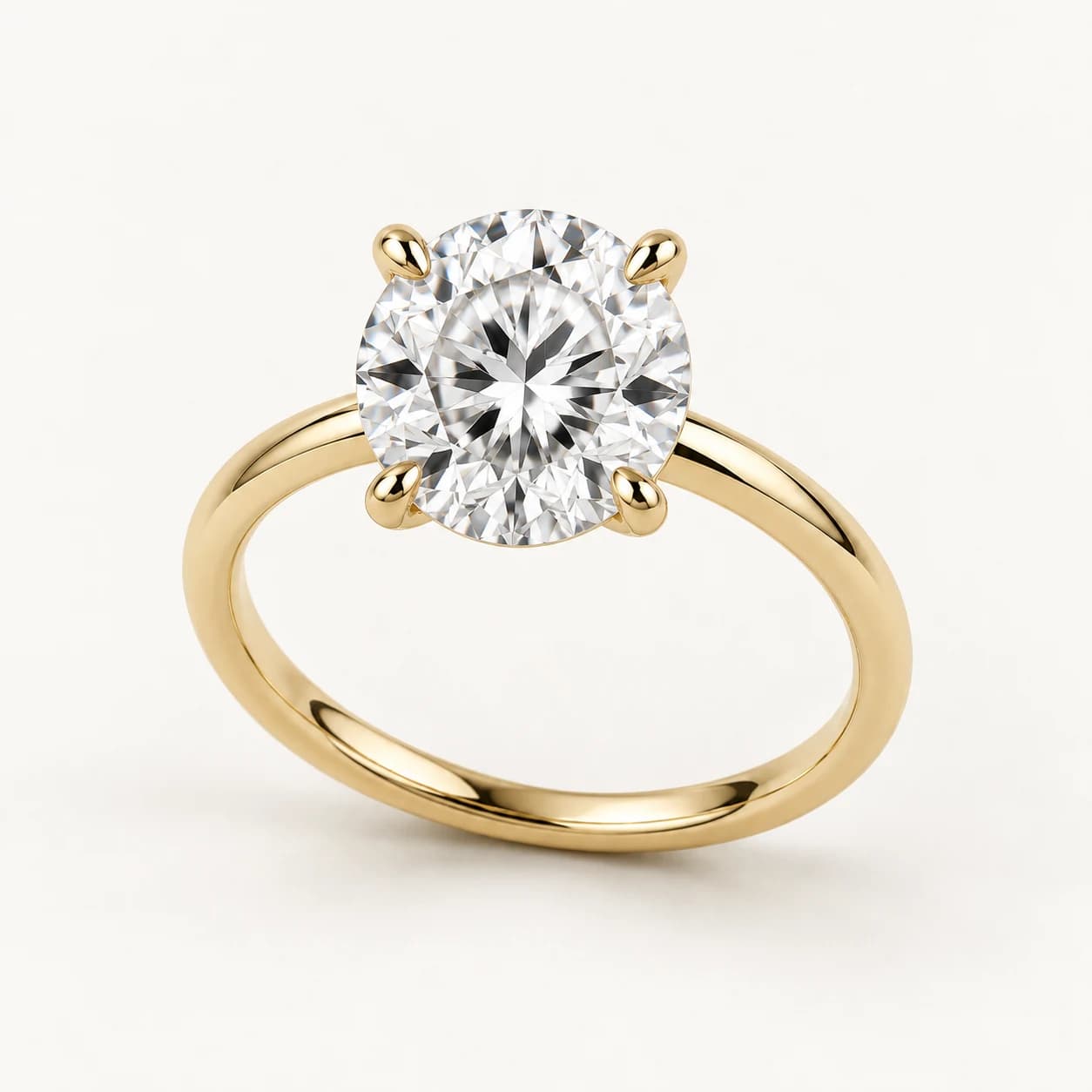 Round diamond solitaire ring in yellow gold
